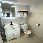 3-Bed Suite with Separate Queen Bed Area (Parking area view)